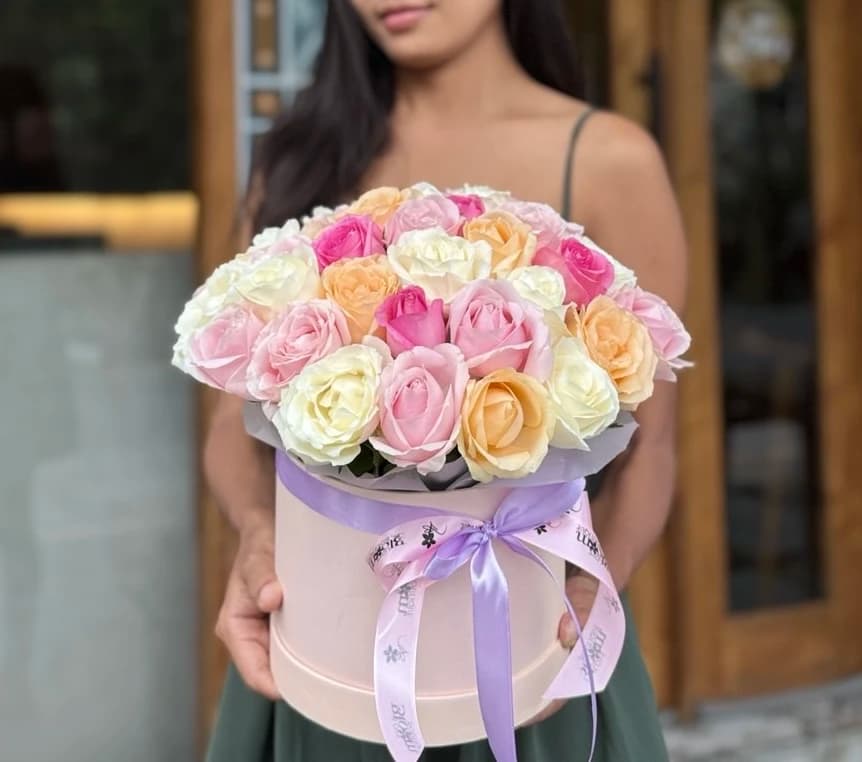 A charming box of pastel Java roses in soft blush tones, perfect for heartfelt moments.
